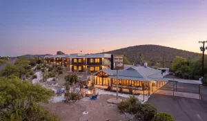 Aerial bird's eye view of Lookout Lodge property in Tombstone, Arizona surrounded by historic Wild West desert landscape