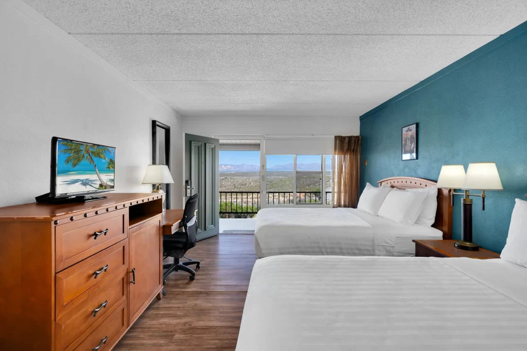 Lawmen Double bed room at historic Tombstone Lookout Lodge with Wild West authentic decor and period furnishings