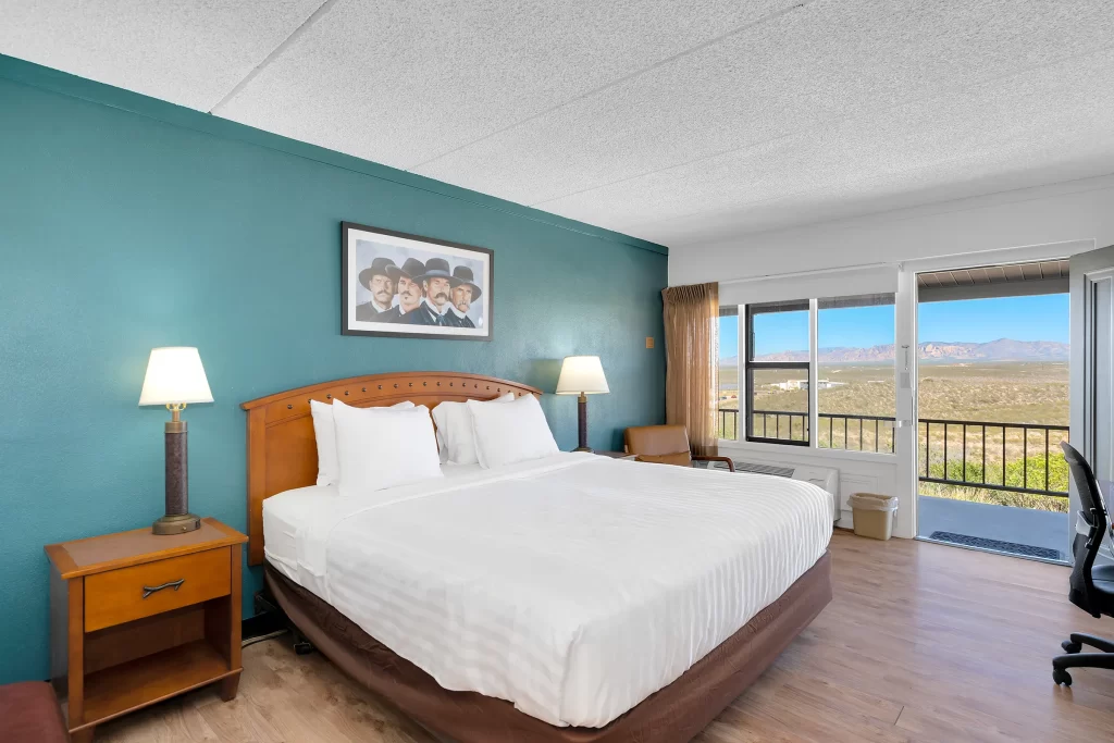 Lawmen King bed room at Tombstone Lookout Lodge with Wild West authentic decor and period furnishings