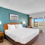 Lawmen King bed room at Tombstone Lookout Lodge with Wild West authentic decor and period furnishings