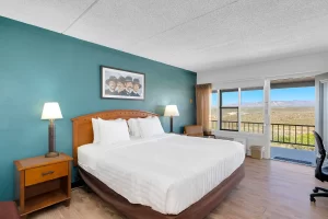 Lawmen King bed room at Tombstone Lookout Lodge with Wild West authentic decor and period furnishings