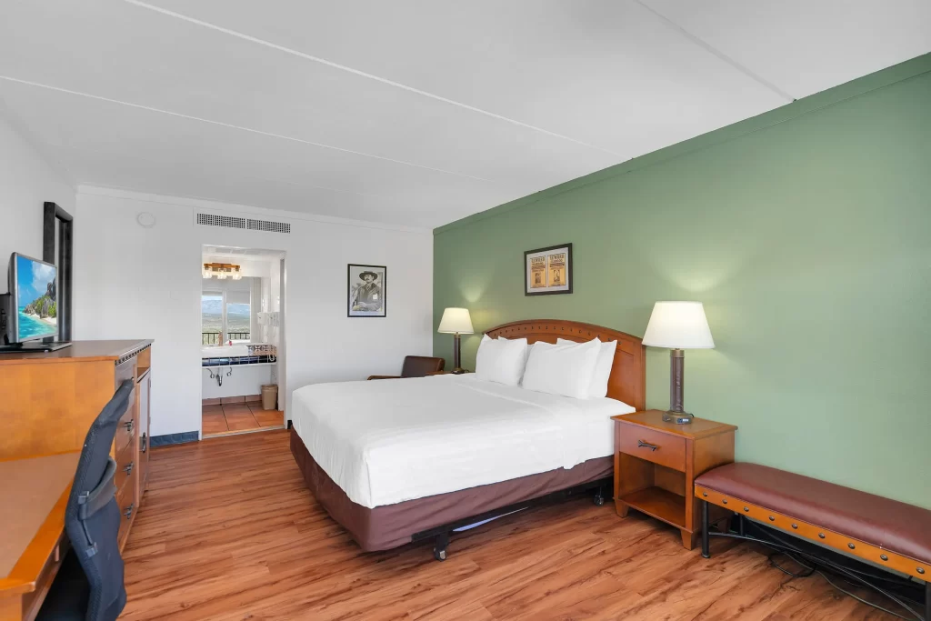 Outlaw King bed room at historic Tombstone Lookout Lodge featuring Wild West themed decor and authentic period furnishings