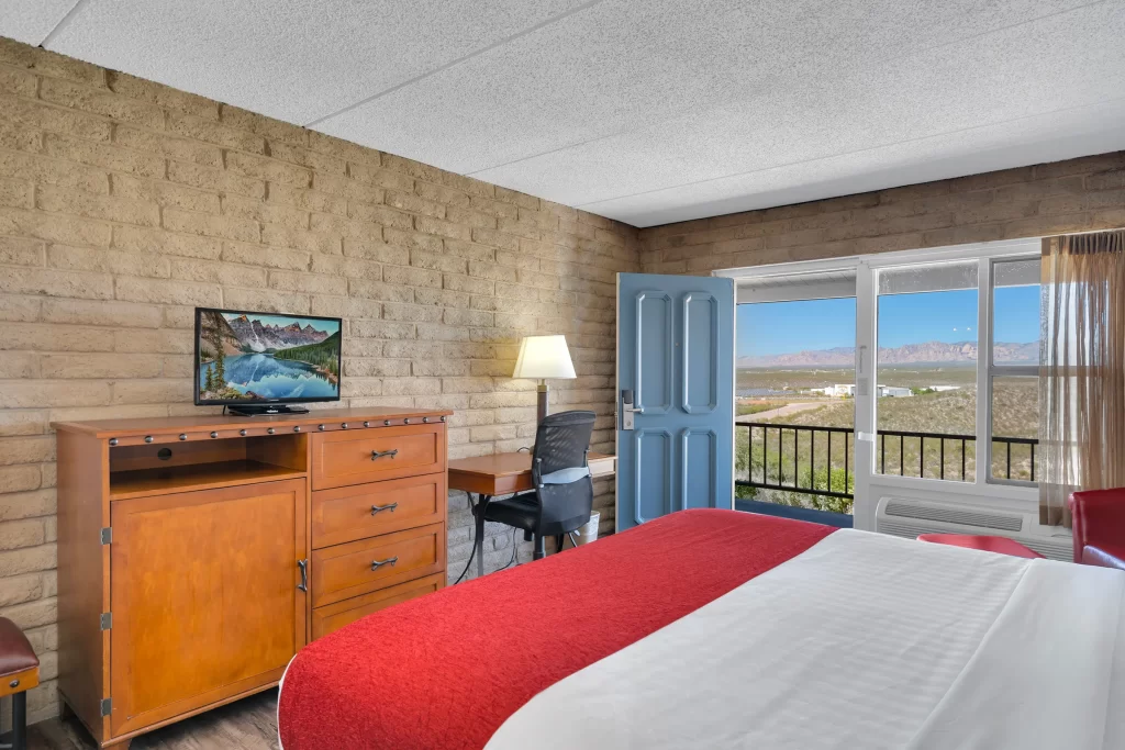 Victorian Ladies king bed room at Tombstone Lookout Lodge featuring historic decor and luxury Wild West accommodations